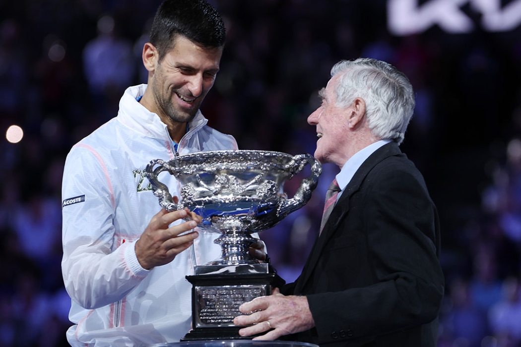 Ken Rosewall presents the Australian Open 2023 men's singles trophy to champion Novak Djokovic