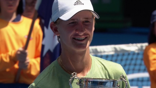 Sebastian Korda presented with junior boys' singles trophy